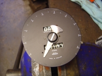  assemble using tiny dot to align pointer, then rotate face around so stop peg is on the correct side of pointer